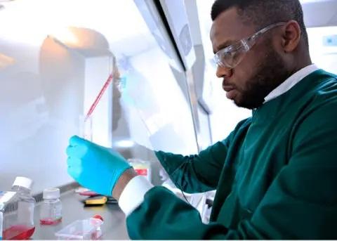 Image of man conducting experiment