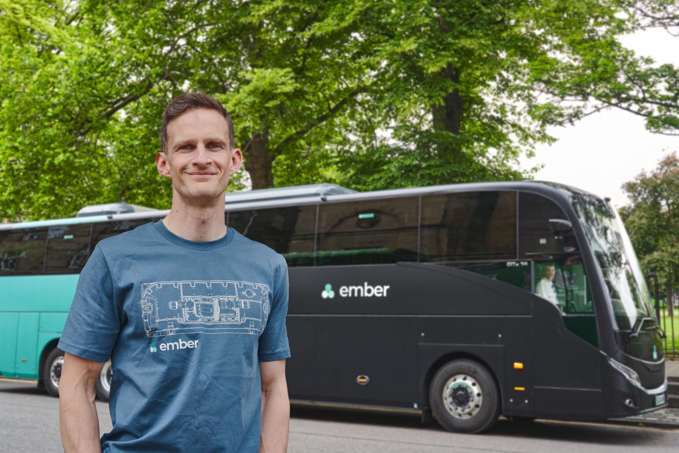 Ember co-founder Keith Bradbury stood in front of one of his buses.